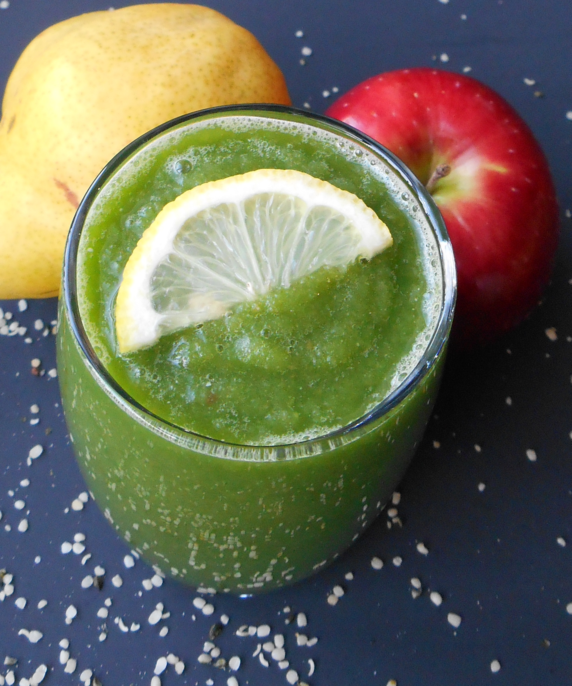 green smoothie with a slice of lemon on top