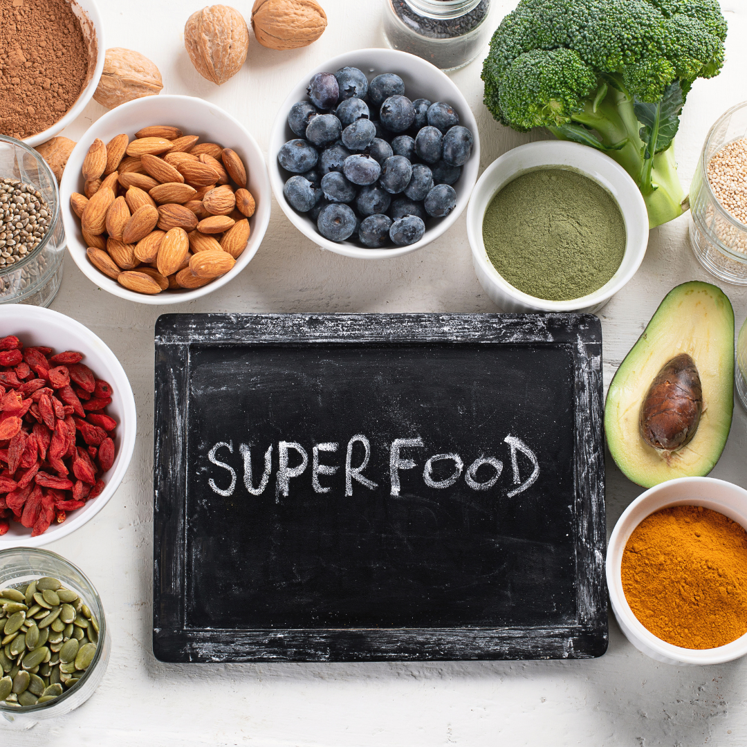 a sign that says superfoods with food around it