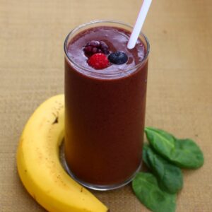 Savor the refreshing blend of frozen mixed berries, banana, and spinach in this indulgent smoothie. A delightful treat in every sip!