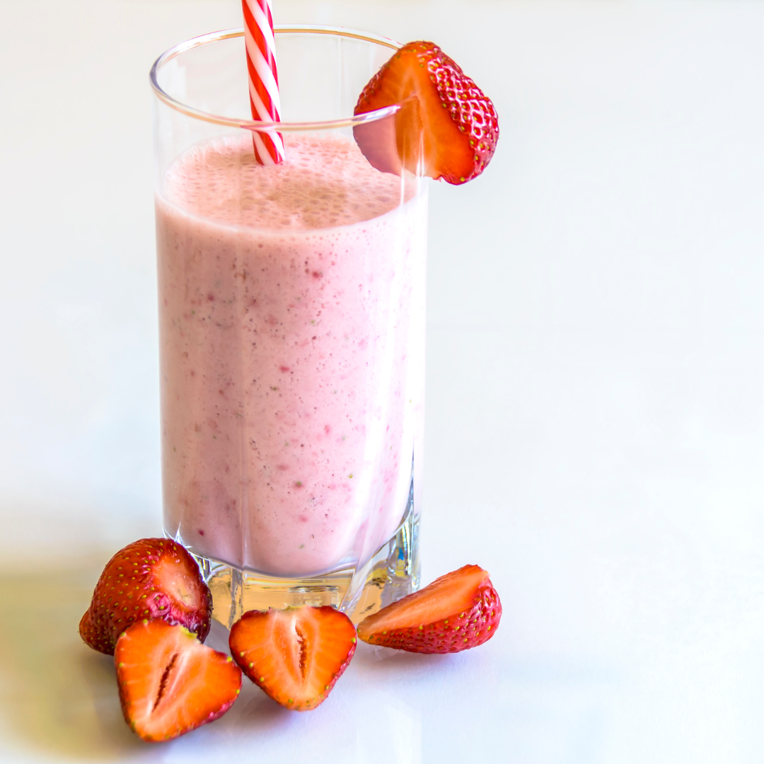 smoothie with strawberries in front