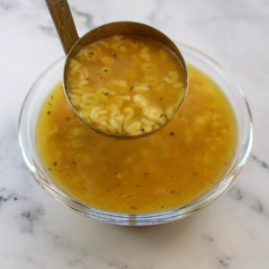 Soup in a bowl with alphabet letter noodles