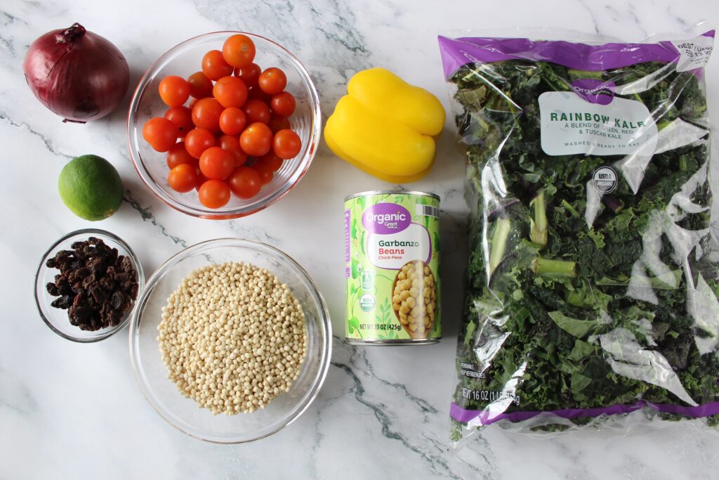 ingredients for couscous salad. kale, pepper, tomatoes, chickpea s nd onions