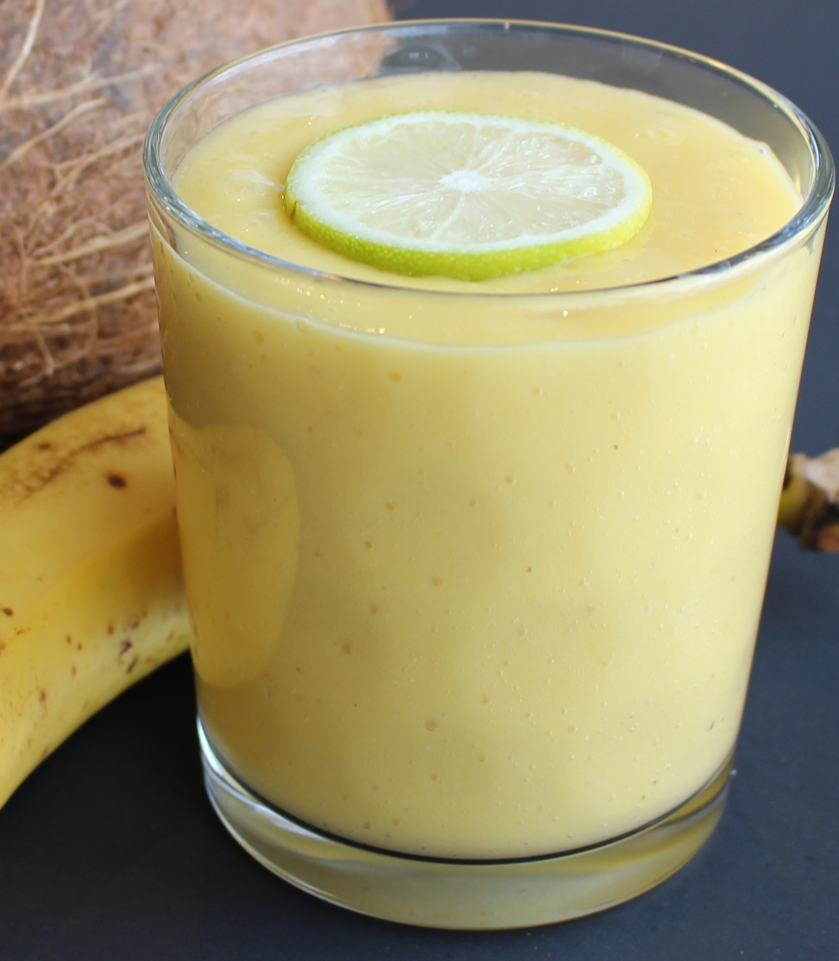 creamy smoothie with lemon on top