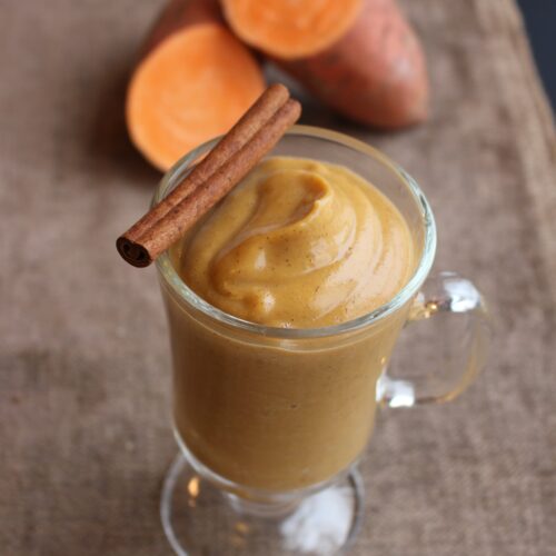 Creamy smoothie and weet potato on side and cinnamon on top