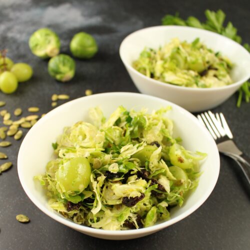 Brussels sprouts salad in a white bowl