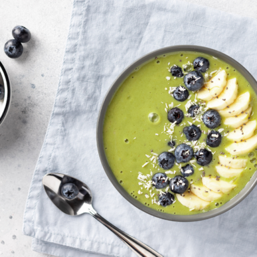 green smoothie bowl with blueberries on top