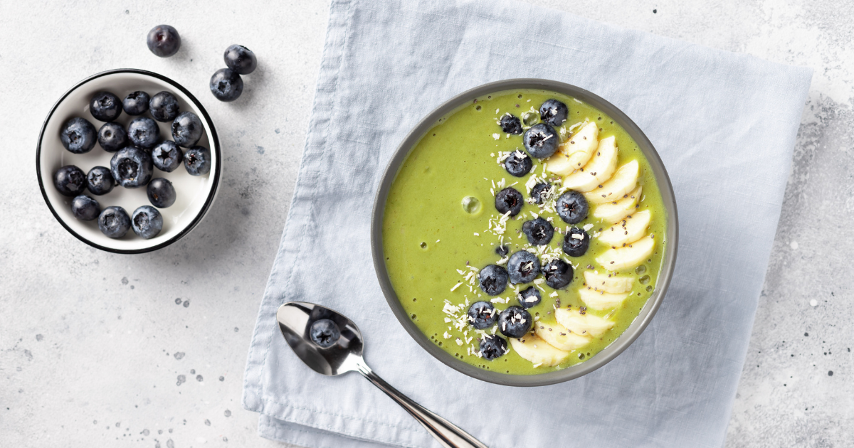 green smoothie bowl with blueberries on top