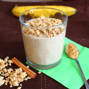 creamy peanut butter smoothie with granola and cinnamon