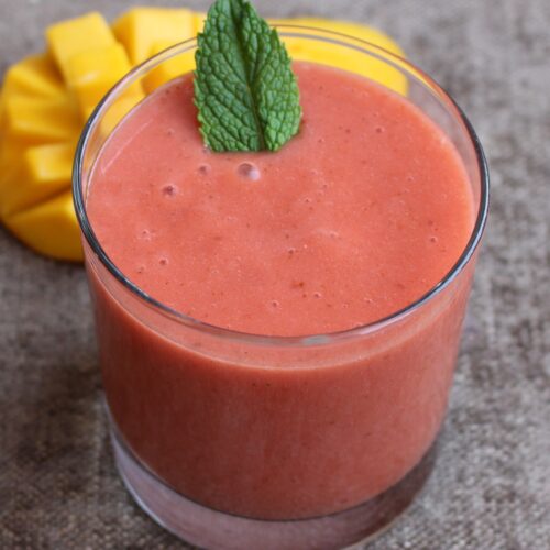 strawberry smoothie with mango and fresh mint leaf