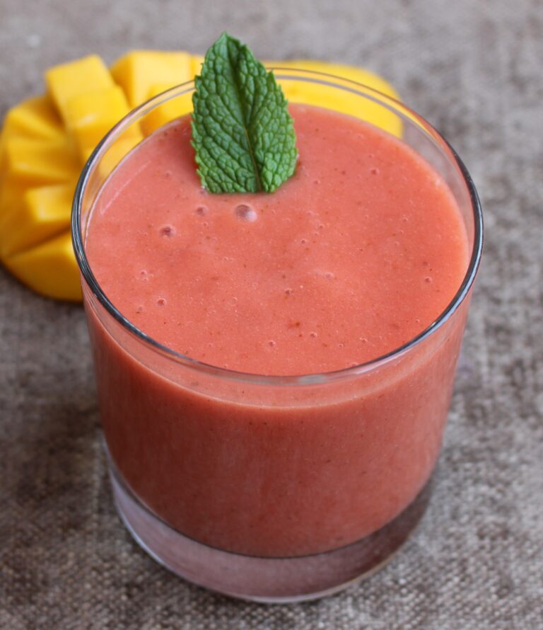 strawberry smoothie with mango and fresh mint leaf