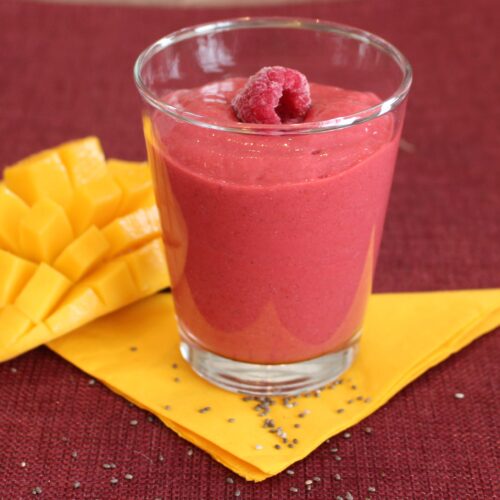 raspberries smoothie with mango on the side