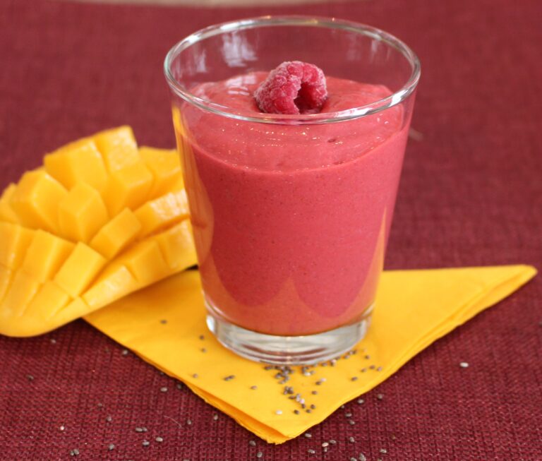 raspberries smoothie with mango on the side