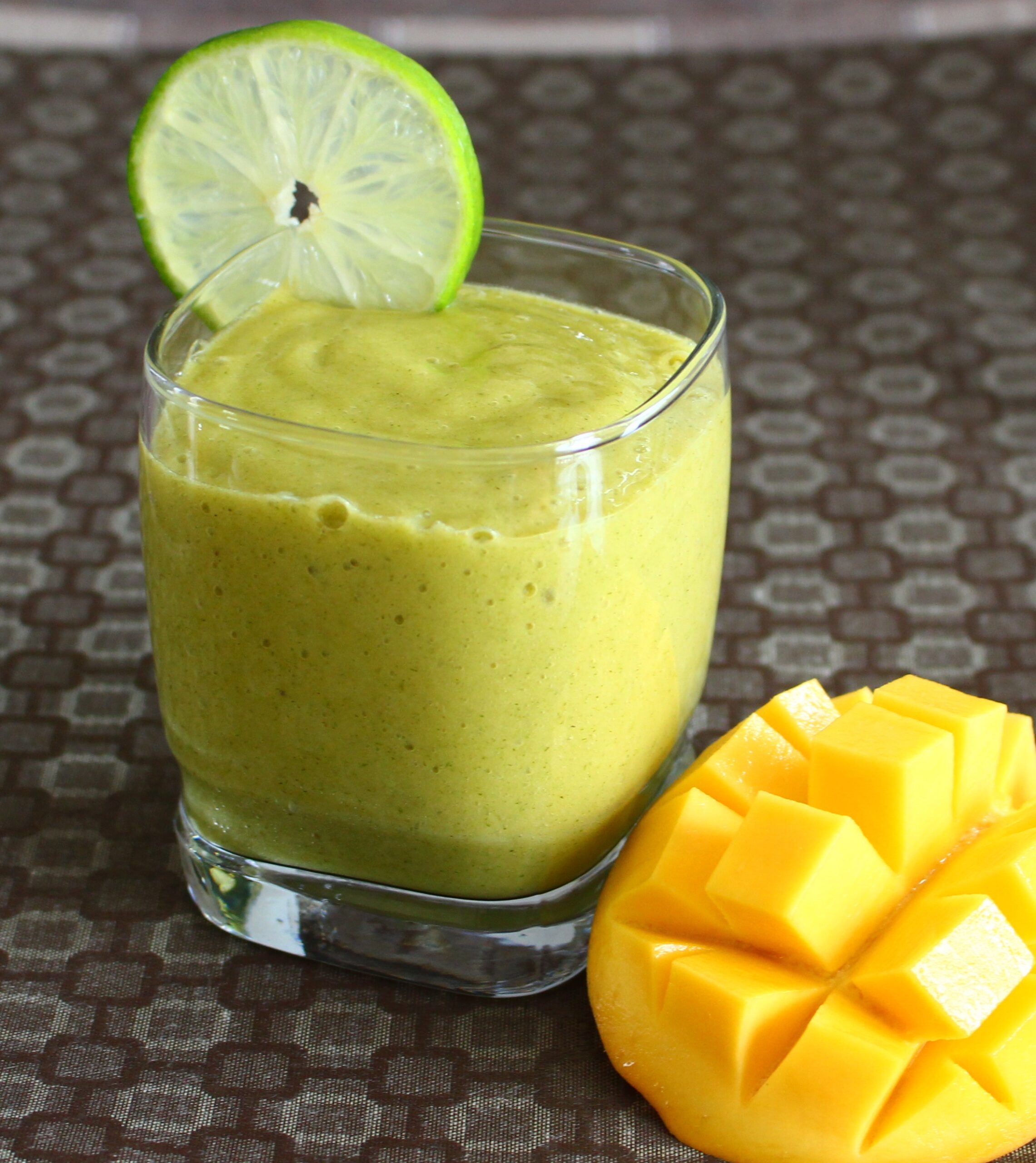 lime smoothie with mango on the side